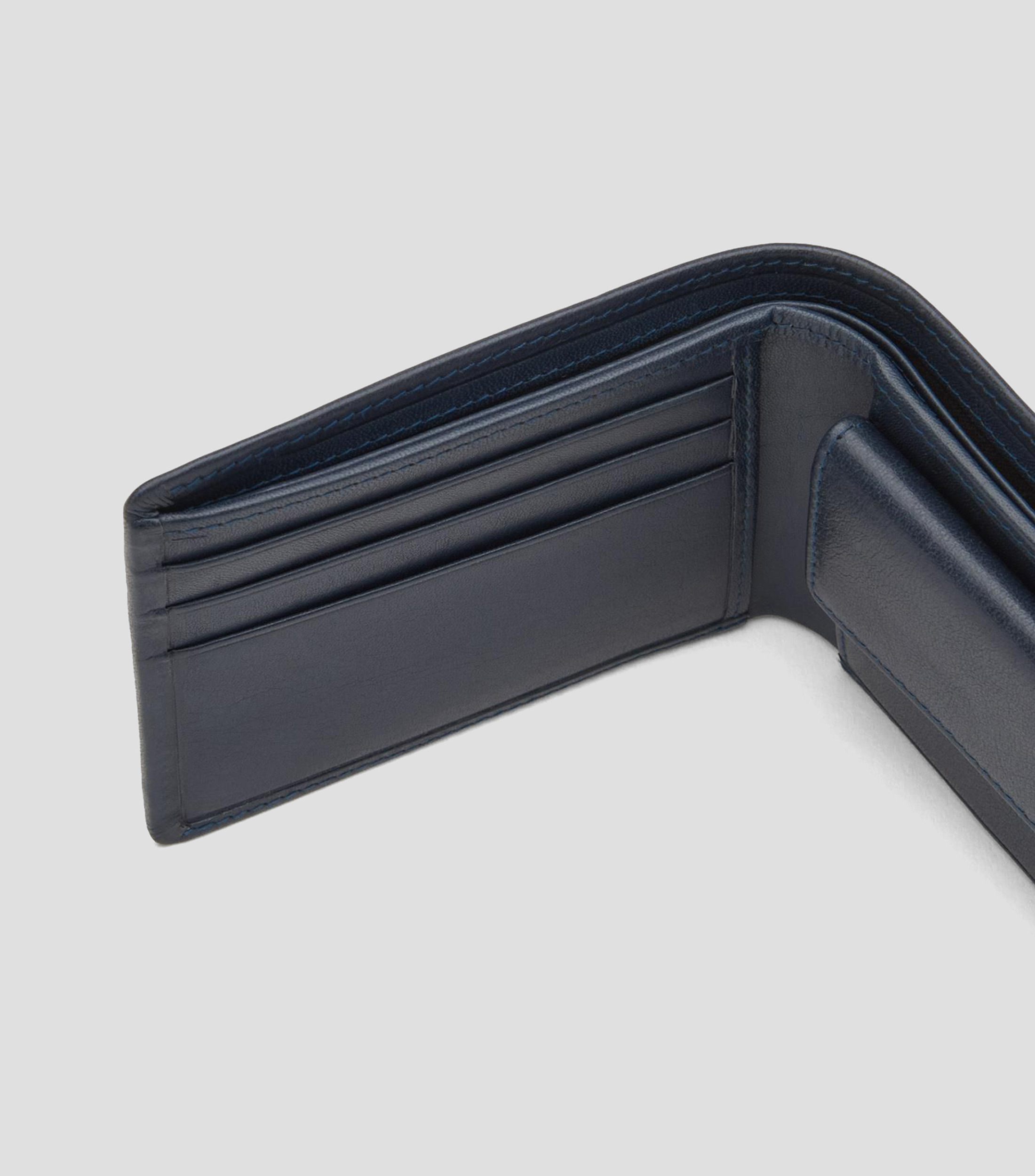 Cartera bifold en piel lisa con detalle texturizado Hombre